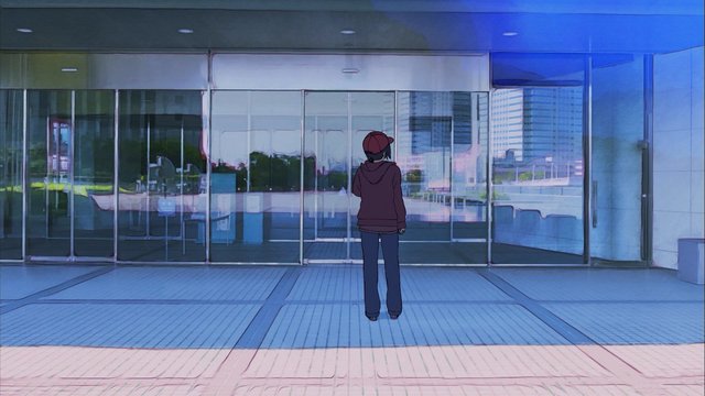 In front of the glass-curtain-walled skyscraper