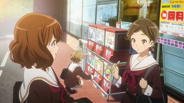 In front of a gacha machine at a 7-Eleven