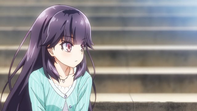 Chika sitting on stone steps