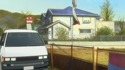 Red arch bridge in front of Ritsu Tainaka's house