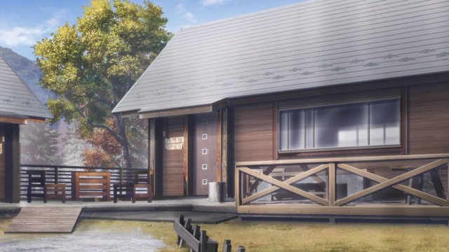露天休憩所のベンチと遠くの山並み