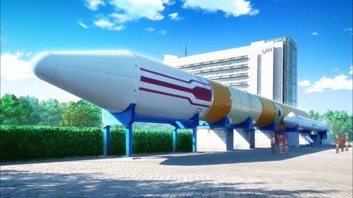 Group photo in front of the H-II Rocket