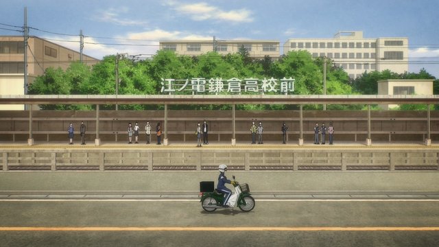 小熊が踏切で待つ