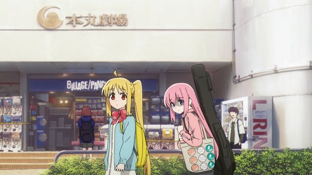 Meeting in front of a large record store