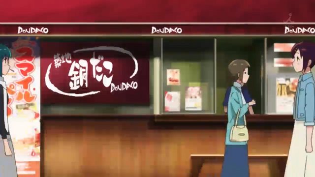 Chatting in front of a takoyaki shop