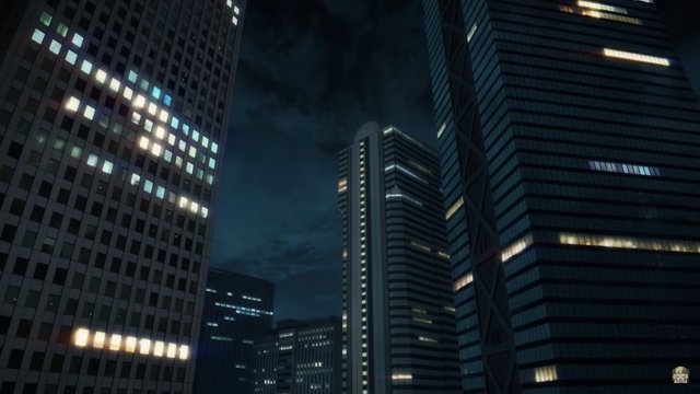 Midnight street in front of glass skyscraper