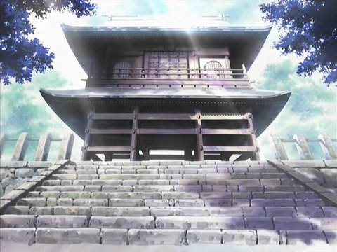 Temple gate with cherry blossoms