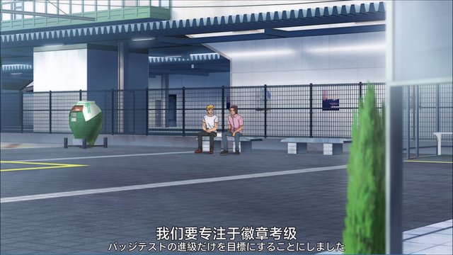 Inori passes poster wall at station