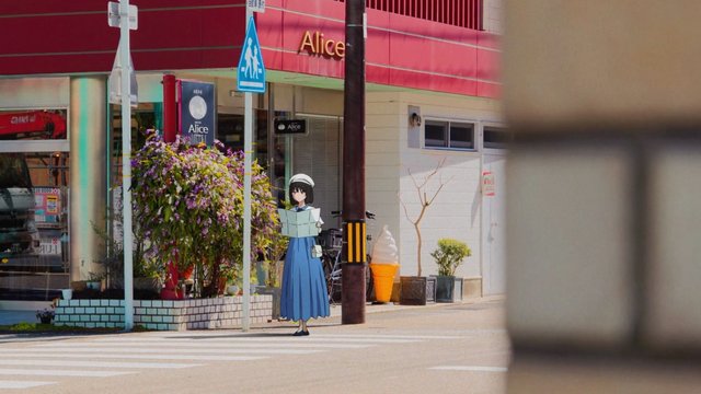 In front of a shop on a shopping street