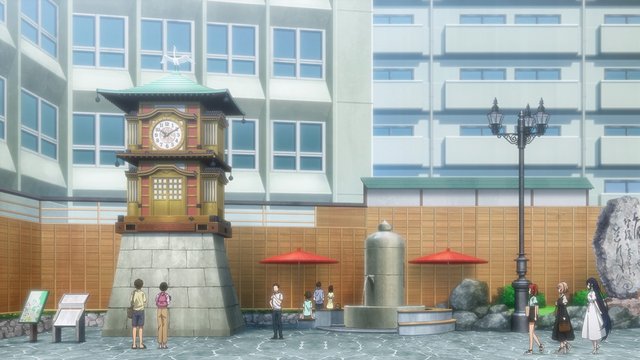 In front of the mechanical clock