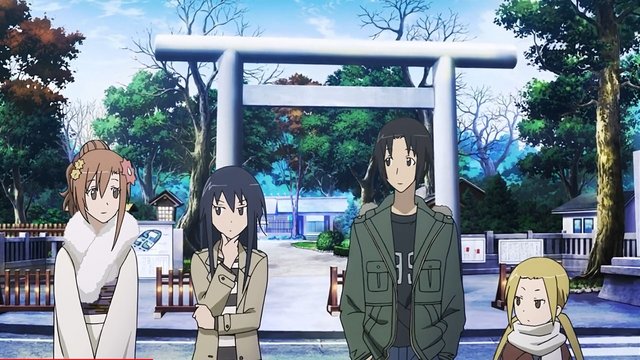 Gathering in front of the shrine's torii gate