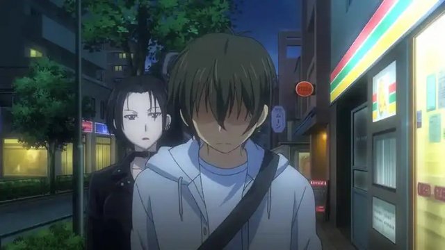 In front of a small discount convenience store