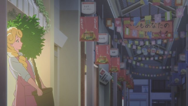 Across from the Daiso, in front of the flower shop