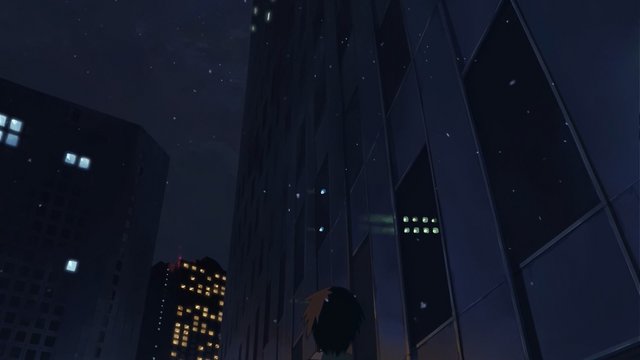 Walking side by side under the triangular building